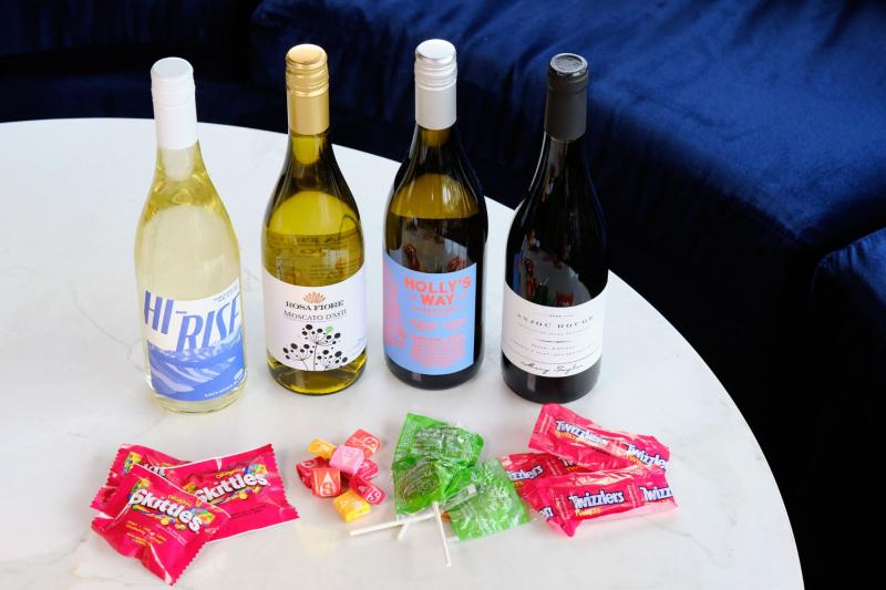 4 wine bottles with candy