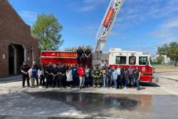 group standing around an Addison fire truck