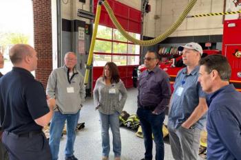 Citizens academy 2023 standing in fire station 1