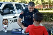 Police fingerprinting a child
