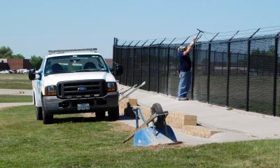 man fixing fence