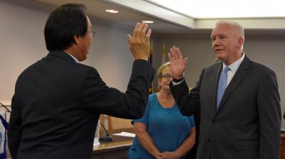 Bruce Arfsten being sworn in as Mayor of Addison