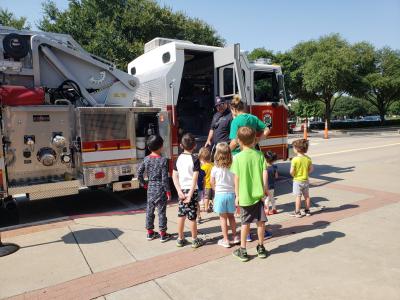 fire fighter tours children at station 1