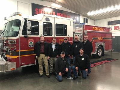 Addison staff in front of new fire truck