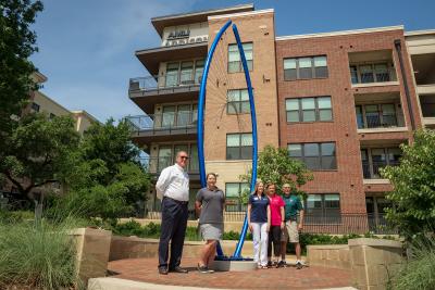 Addison Council members and Staff in front of public art sculpture