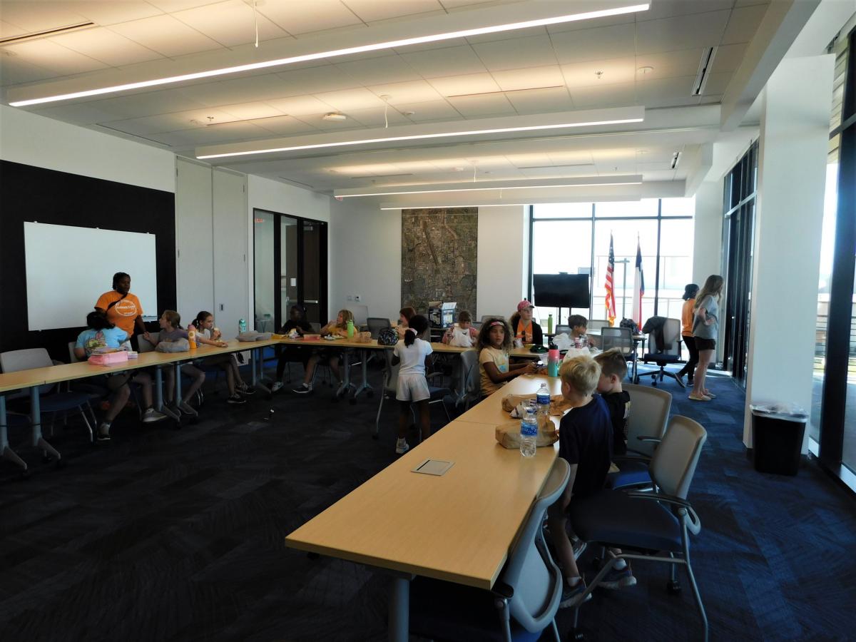 kids sitting a conference table