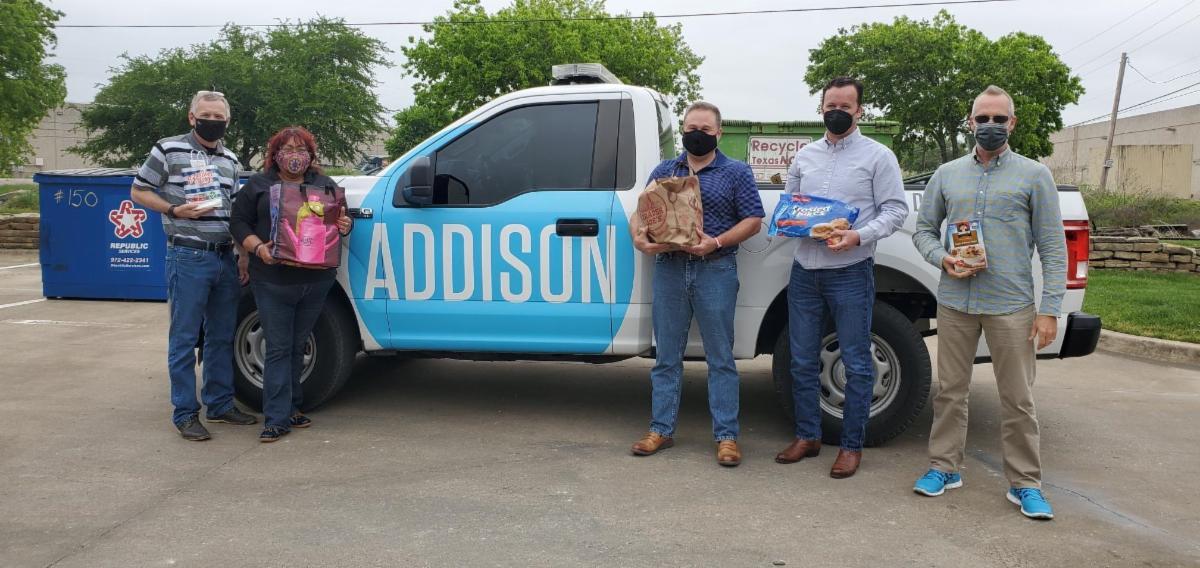 Addison staff holding food donations